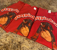 three red t - shirts with a rottweiler on them